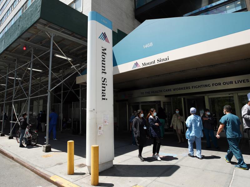 A view of the entrance to Mount Sinai Hospital in New York City on May 14, 2020. Hospital and nursing home workers across New York are required to have at least one dose of a COVID-19 vaccine by Monday, prompting concerns over noncompliance and potential A view of the entrance to Mount Sinai Hospital in New York City on May 14, 2020. Hospital and nursing home workers across New York are required to have at least one dose of a COVID-19 vaccine by Monday, prompting concerns over noncompliance and potential
