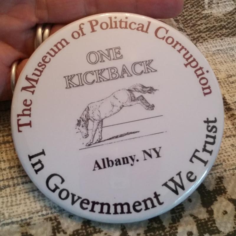 Every member of the board for the Museum of Political Corruption received this "kickback" button in their information folders at a recent meeting. Every member of the board for the Museum of Political Corruption received this "kickback" button in their information folders at a recent meeting.