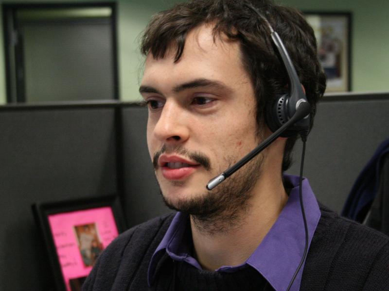 Joey Cappuccitti, who works at a Maximus call center, talks with a person looking for help with New York's insurance exchange. Joey Cappuccitti, who works at a Maximus call center, talks with a person looking for help with New York's insurance exchange.