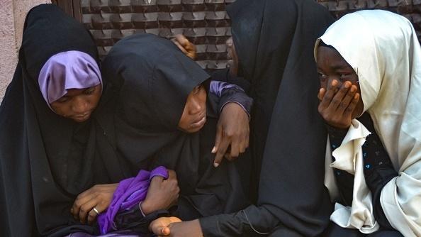 Mourners attend the burial of people killed in violent clashes in Abuja, Nigeria's capital, between Nigerian soldiers and members of the Islamic Movement of Nigeria. Mourners attend the burial of people killed in violent clashes in Abuja, Nigeria's capital, between Nigerian soldiers and members of the Islamic Movement of Nigeria.