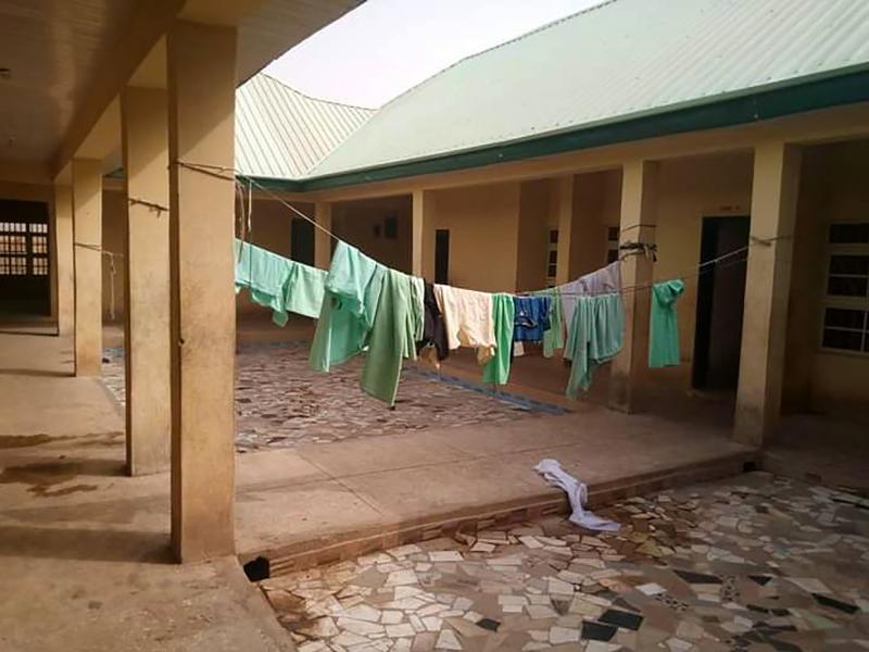 School uniforms hang in the deserted dormitory of the Government Girls Science Secondary School at Jangede, Zamfara State in northwest Nigeria, where more than 300 students were kidnapped by gunmen early Friday, local time. School uniforms hang in the deserted dormitory of the Government Girls Science Secondary School at Jangede, Zamfara State in northwest Nigeria, where more than 300 students were kidnapped by gunmen early Friday, local time.