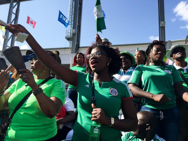 Nigerian fans stand and deliver cheers at a match against Australia, played during the Women's World Cup in Winnipeg, Canada. Nigerian fans stand and deliver cheers at a match against Australia, played during the Women's World Cup in Winnipeg, Canada.