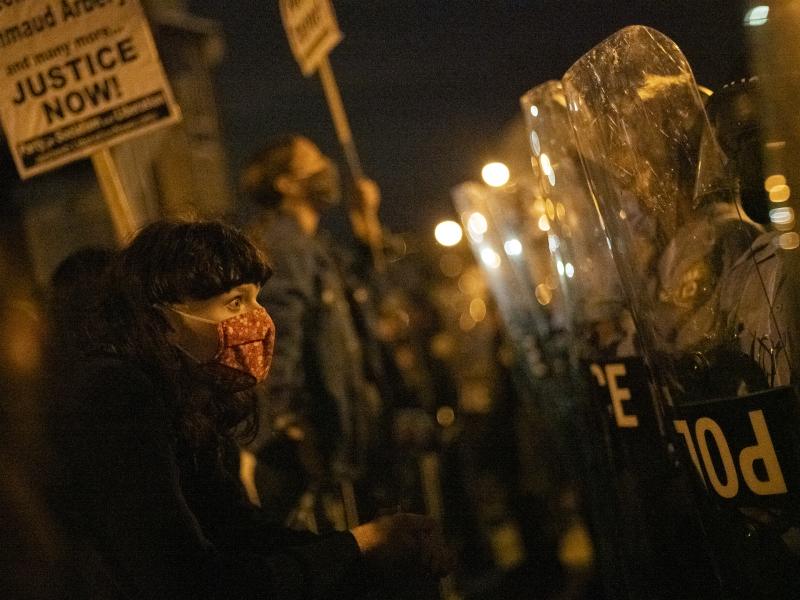 A demonstrator confronts police officers during a protest against the shooting of 27-year-old Walter Wallace. A demonstrator confronts police officers during a protest against the shooting of 27-year-old Walter Wallace.