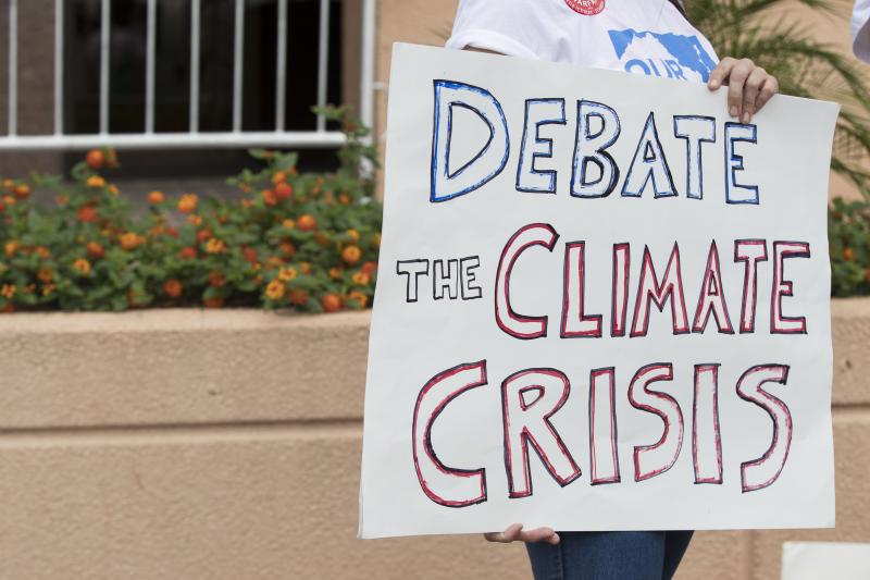 Greenpeace Protests Outside DNC Headquarters Urging The Party To Hold A Climate Change Debate Greenpeace Protests Outside DNC Headquarters Urging The Party To Hold A Climate Change Debate