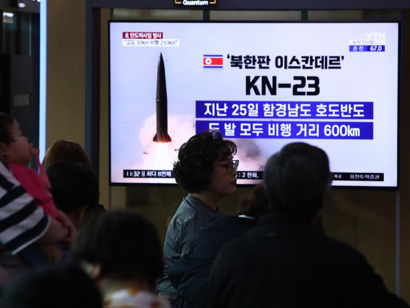 South Koreans in Seoul on Wednesday watch a news report about a missile launch. South Koreans in Seoul on Wednesday watch a news report about a missile launch.