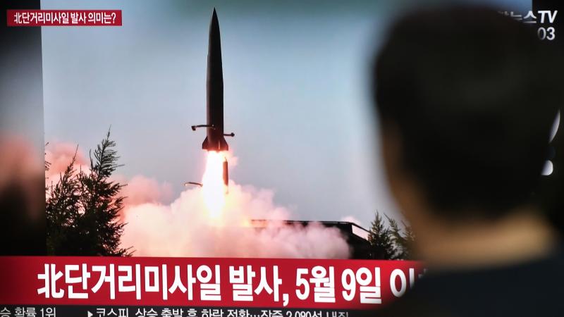 A man at a railway station in Seoul watches a television showing file footage of a North Korean missile launch on Thursday. Earlier, North Korea had fired two short-range missiles into the sea. A man at a railway station in Seoul watches a television showing file footage of a North Korean missile launch on Thursday. Earlier, North Korea had fired two short-range missiles into the sea.