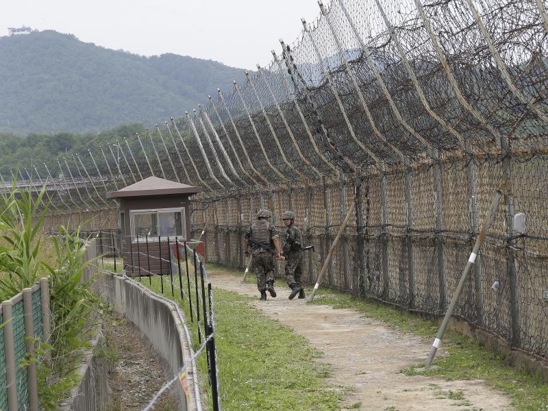South Korean soldiers patrol while hikers visit the DMZ Peace Trail in the Demilitarized Zone in Goseong, South Korea. A defector from North Korea was apprehended in Goseong last week after evading South Korean guards for hours. South Korean soldiers patrol while hikers visit the DMZ Peace Trail in the Demilitarized Zone in Goseong, South Korea. A defector from North Korea was apprehended in Goseong last week after evading South Korean guards for hours.