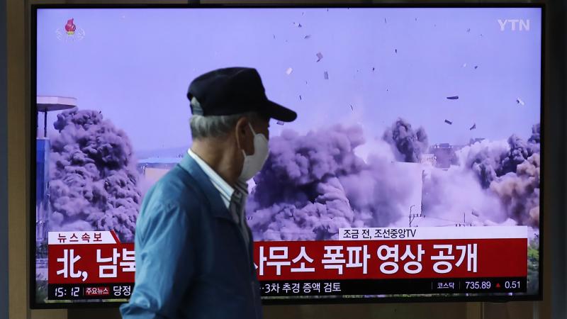 A man watches a television screen showing a news program with video of the demolition of the inter-Korean liaison office building in Kaesong, North Korea, at the Seoul Railway Station on Wednesday. A man watches a television screen showing a news program with video of the demolition of the inter-Korean liaison office building in Kaesong, North Korea, at the Seoul Railway Station on Wednesday.