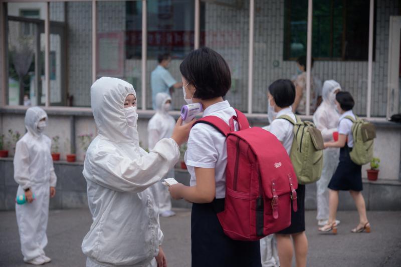 Students of the Pyongyang Jang Chol Gu University of Commerce in North Korea undergo temperature checks before entering the campus. The country said there were no cases — until May 12. Students of the Pyongyang Jang Chol Gu University of Commerce in North Korea undergo temperature checks before entering the campus. The country said there were no cases — until May 12.