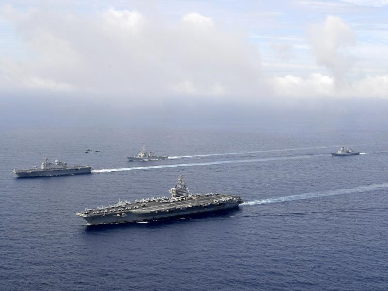 FILE - In this photo provided by South Korea's Defense Ministry, U.S. nuclear-powered aircraft carrier USS Ronald Reagan, second from left, and South Korea's landing platform helicopter (LPH) ship Marado, left, sail during a joint military exercise at an FILE - In this photo provided by South Korea's Defense Ministry, U.S. nuclear-powered aircraft carrier USS Ronald Reagan, second from left, and South Korea's landing platform helicopter (LPH) ship Marado, left, sail during a joint military exercise at an