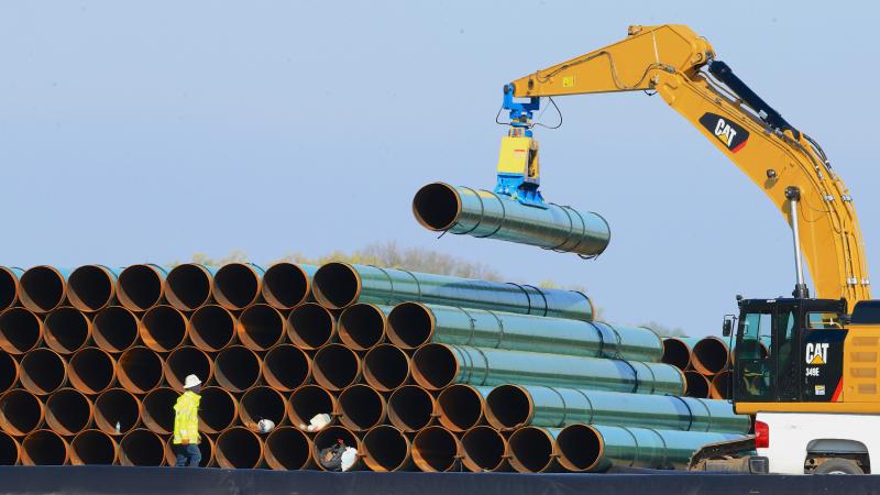 Pipes for the Dakota Access Pipeline are stacked at a staging area in Worthing, S.D., in 2015. Pipes for the Dakota Access Pipeline are stacked at a staging area in Worthing, S.D., in 2015.