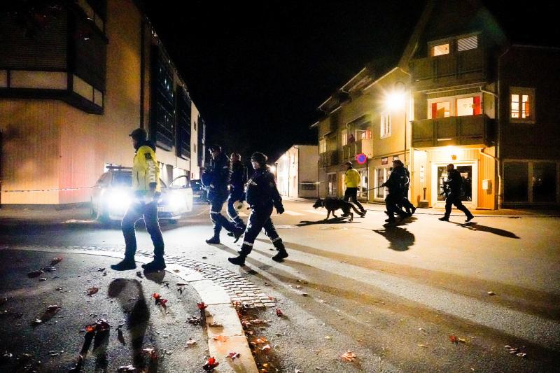 Police officers investigate a scene in Kongsberg, Norway, after a man armed with a bow killed several people before he was arrested Wednesday. Police officers investigate a scene in Kongsberg, Norway, after a man armed with a bow killed several people before he was arrested Wednesday.
