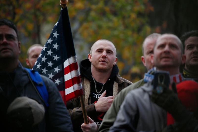 Attendees recite the Pledge of Allegiance during the United Against Hate rally by the Washington Three Percent in Seattle last month. Attendees recite the Pledge of Allegiance during the United Against Hate rally by the Washington Three Percent in Seattle last month.