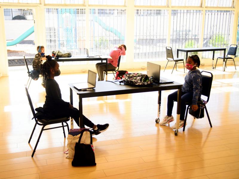Children attend online classes at the Crenshaw Family YMCA in Los Angeles. Schools are having a hard time covering the costs required for in-person and online learning during the pandemic. Children attend online classes at the Crenshaw Family YMCA in Los Angeles. Schools are having a hard time covering the costs required for in-person and online learning during the pandemic.