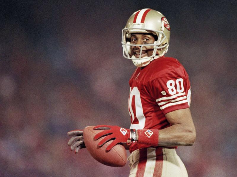 Jerry Rice smiles during a game on Dec. 3, 1994, at Candlestick Park in San Francisco. Jerry Rice smiles during a game on Dec. 3, 1994, at Candlestick Park in San Francisco.