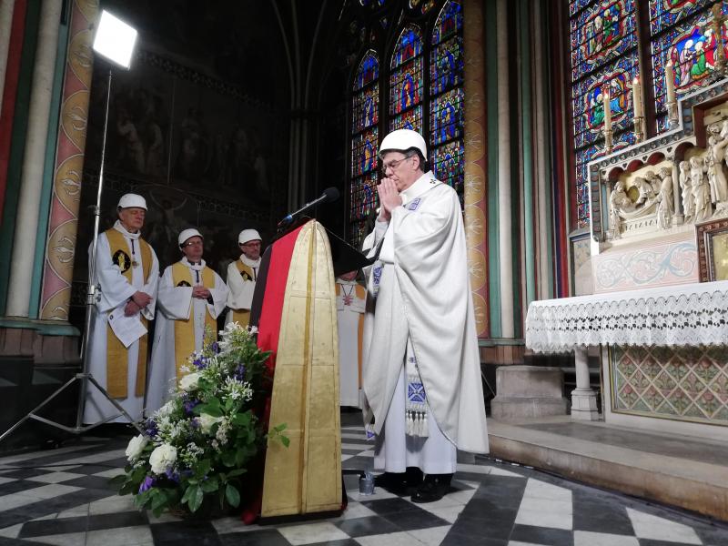 A small group in hard hats gathered on Saturday for Mass in Paris' Notre Dame cathedral. It was the first Mass since a fire devastated the church in April. A small group in hard hats gathered on Saturday for Mass in Paris' Notre Dame cathedral. It was the first Mass since a fire devastated the church in April.