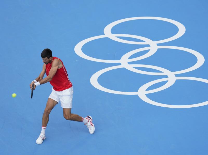 Serbia's Novak Djokovic practices for the men's tennis competition on Thursday at the Summer Olympics. Serbia's Novak Djokovic practices for the men's tennis competition on Thursday at the Summer Olympics.
