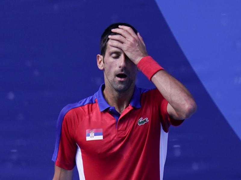 Novak Djokovic of Serbia reacts during the bronze medal match that he lost to Spain's Pablo Carreño Busta at the Tokyo Olympics on Saturday. Novak Djokovic of Serbia reacts during the bronze medal match that he lost to Spain's Pablo Carreño Busta at the Tokyo Olympics on Saturday.