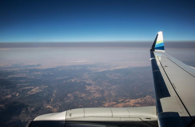A thick layer of smoke from the Carr Fire settles over California's Central Valley in a view from a jet earlier this summer. Fine particulate matter from drifting wildfire smoke mixes with industrial ozone and can become trapped between the mountain range A thick layer of smoke from the Carr Fire settles over California's Central Valley in a view from a jet earlier this summer. Fine particulate matter from drifting wildfire smoke mixes with industrial ozone and can become trapped between the mountain range