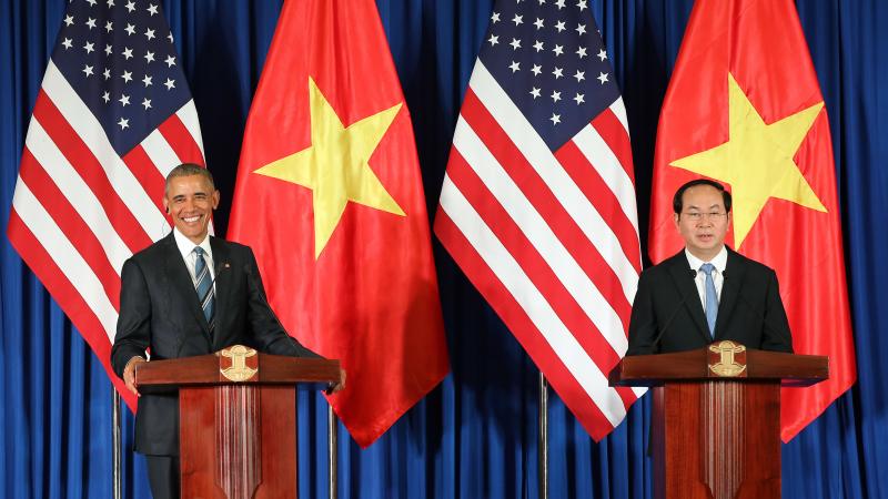 Vietnamese President Tran Dai Quang and U.S. President Obama take part in a joint press conference Monday at the International Convention Center in Hanoi. Vietnamese President Tran Dai Quang and U.S. President Obama take part in a joint press conference Monday at the International Convention Center in Hanoi.
