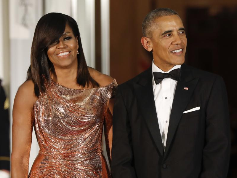 President Barack Obama and first lady Michelle Obama wait to greet Italian Prime Minister Matteo Renzi and his wife, Agnese Landini, for a State Dinner at the White House in Washington in 2016. Netflix says it has reached a deal with the Obamas to produce President Barack Obama and first lady Michelle Obama wait to greet Italian Prime Minister Matteo Renzi and his wife, Agnese Landini, for a State Dinner at the White House in Washington in 2016. Netflix says it has reached a deal with the Obamas to produce