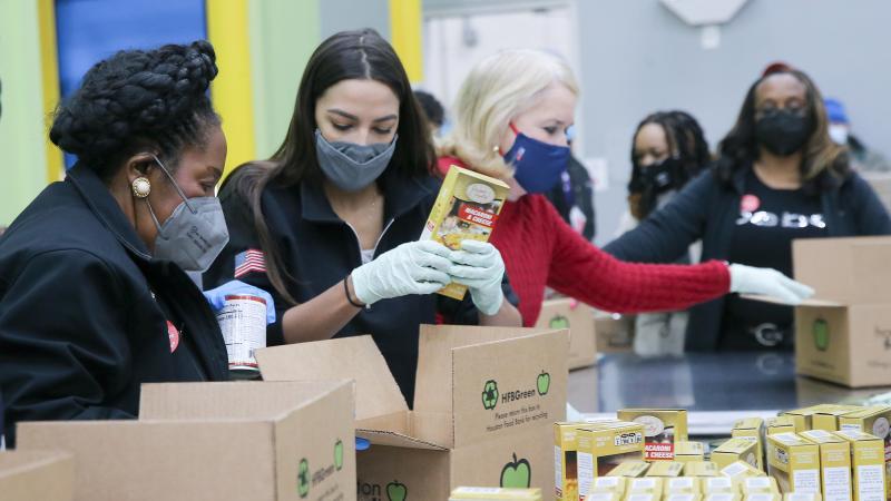 Reps. Sheila Jackson Lee, Alexandria Ocasio-Cortez and Sylvia Garcia help distribute food at the Houston Food Bank on Saturday. Reps. Sheila Jackson Lee, Alexandria Ocasio-Cortez and Sylvia Garcia help distribute food at the Houston Food Bank on Saturday.
