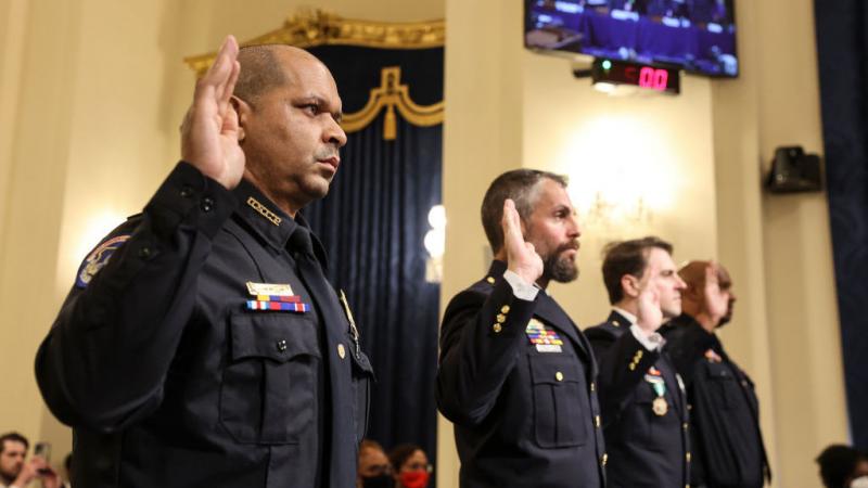 U.S. Capitol Police Sgt. Aquilino Gonell (from left), officers Michael Fanone and Daniel Hodges of the Washington, D.C., Metropolitan Police Department, and Capitol Police Pfc. Harry Dunn are sworn in Tuesday before testifying before the House select comm U.S. Capitol Police Sgt. Aquilino Gonell (from left), officers Michael Fanone and Daniel Hodges of the Washington, D.C., Metropolitan Police Department, and Capitol Police Pfc. Harry Dunn are sworn in Tuesday before testifying before the House select comm
