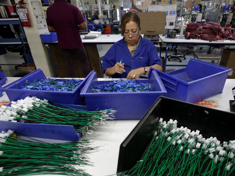 An employee works at a wiring harness and cable assembly manufacturing company in Ciudad Juárez, Mexico, that exports to the U.S. in 2017. The auto industry says threatened tariffs would play havoc with supply chains. An employee works at a wiring harness and cable assembly manufacturing company in Ciudad Juárez, Mexico, that exports to the U.S. in 2017. The auto industry says threatened tariffs would play havoc with supply chains.