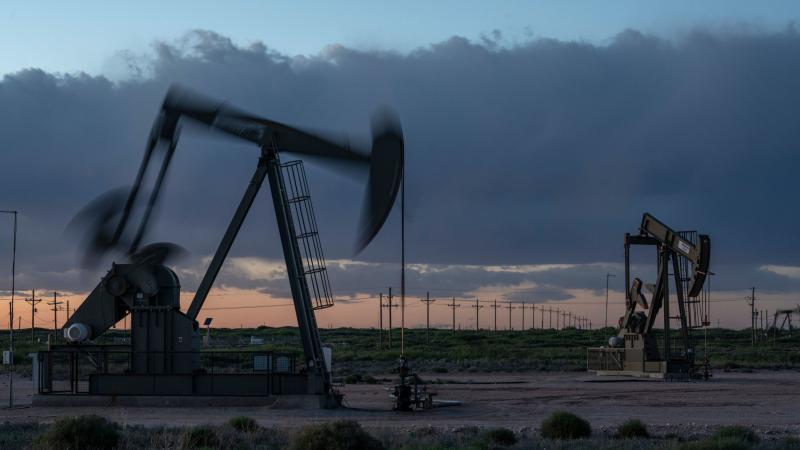 Pump jacks operate at dusk near Loco Hills in Eddy County, New Mexico, on April 23. U.S. oil producers are grappling with prolonged low oil prices and the uncertainty created by the coronavirus pandemic. Pump jacks operate at dusk near Loco Hills in Eddy County, New Mexico, on April 23. U.S. oil producers are grappling with prolonged low oil prices and the uncertainty created by the coronavirus pandemic.