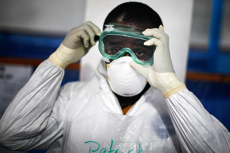 Dr. Patrick Kamara adjusts his goggles on the final day of training and the first "dress rehearsal" before being sent out to Ebola treatment units. The World Health Organization is ramping up to train up to 500 new health workers a week as part of the eff Dr. Patrick Kamara adjusts his goggles on the final day of training and the first "dress rehearsal" before being sent out to Ebola treatment units. The World Health Organization is ramping up to train up to 500 new health workers a week as part of the eff