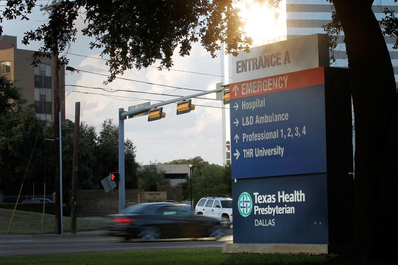 Traffic moves past Texas Health Presbyterian Hospital in Dallas, where a patient showed up with symptoms that were later confirmed to be Ebola. Traffic moves past Texas Health Presbyterian Hospital in Dallas, where a patient showed up with symptoms that were later confirmed to be Ebola.