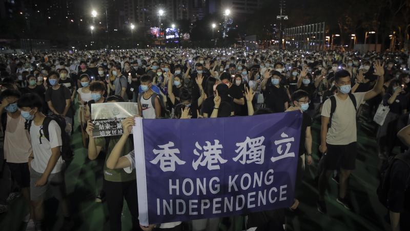 People attending a vigil for the victims of the 1989 Tiananmen Square massacre hold a banner reading "Hong Kong independence" at Victoria Park in Causeway Bay, Hong Kong, on Thursday. Official applications for the rally were denied. People attending a vigil for the victims of the 1989 Tiananmen Square massacre hold a banner reading "Hong Kong independence" at Victoria Park in Causeway Bay, Hong Kong, on Thursday. Official applications for the rally were denied.