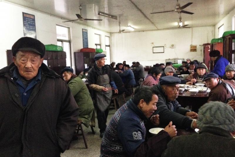 Senior citizens eat dinner in the unheated dining room of their government-funded retirement home in rapidly aging Juegang Township, Rudong County, in eastern China's Jiangsu province. Just a few years ago, the town had only one such facility; now it has Senior citizens eat dinner in the unheated dining room of their government-funded retirement home in rapidly aging Juegang Township, Rudong County, in eastern China's Jiangsu province. Just a few years ago, the town had only one such facility; now it has