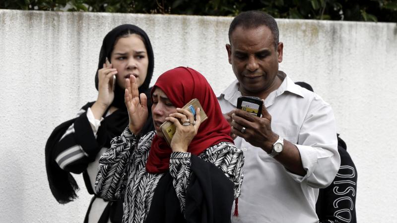 People wait outside a mosque in central Christchurch, New Zealand, on Friday after mass shootings in two locations. People wait outside a mosque in central Christchurch, New Zealand, on Friday after mass shootings in two locations.