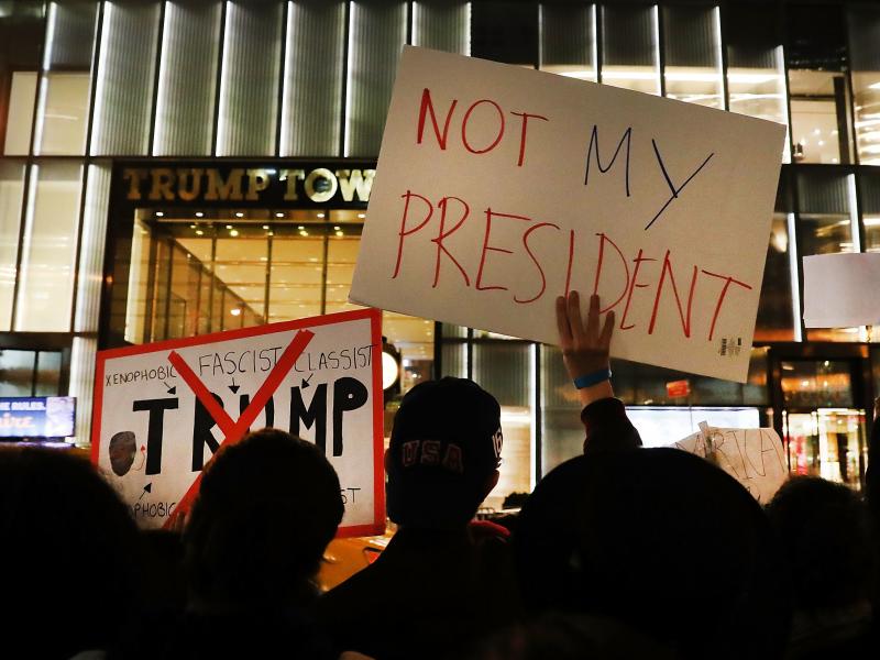 NEW YORK, NY - NOVEMBER 10: Dozens of anti-Donald Trump protesters stand along 5th Avenue in front of Trump Tower as New Yorkers react for a second night to the election of Trump as president of the United States on November 10, 2016 in New York City. Tru NEW YORK, NY - NOVEMBER 10: Dozens of anti-Donald Trump protesters stand along 5th Avenue in front of Trump Tower as New Yorkers react for a second night to the election of Trump as president of the United States on November 10, 2016 in New York City. Tru