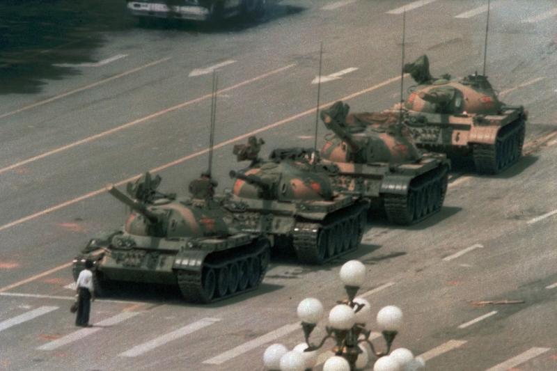 A Chinese man stands alone to block a line of tanks heading east on Beijing's Cangan Boulevard in Tiananmen Square on June 5, 1989. China faced unprecedented criticism of its brutal repression of unarmed citizens demanding more freedoms. More recently, Ch A Chinese man stands alone to block a line of tanks heading east on Beijing's Cangan Boulevard in Tiananmen Square on June 5, 1989. China faced unprecedented criticism of its brutal repression of unarmed citizens demanding more freedoms. More recently, Ch