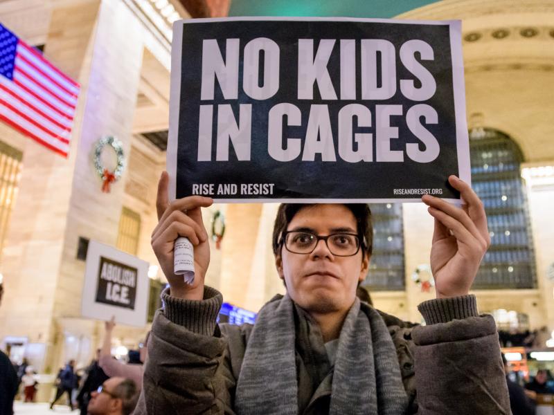 A demonstrator holds a sign at a silent protest about U.S. immigration policy at Grand Central Station in New York City. A demonstrator holds a sign at a silent protest about U.S. immigration policy at Grand Central Station in New York City.