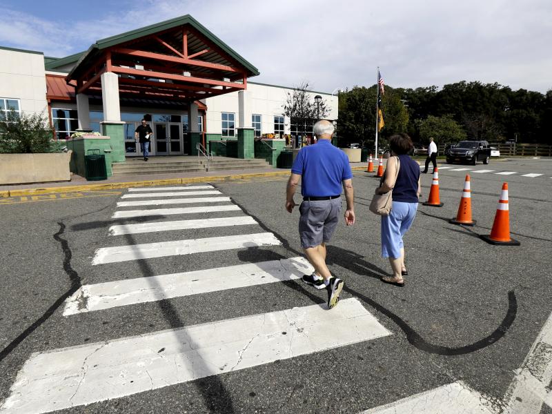 People head into the service building at the Cheesequake Rest Area in South Amboy, N.J. People head into the service building at the Cheesequake Rest Area in South Amboy, N.J.
