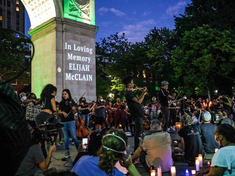 String players perform during a violin vigil for Elijah McClain in Washington Square Park on June 29, 2020, in New York City. String players perform during a violin vigil for Elijah McClain in Washington Square Park on June 29, 2020, in New York City.