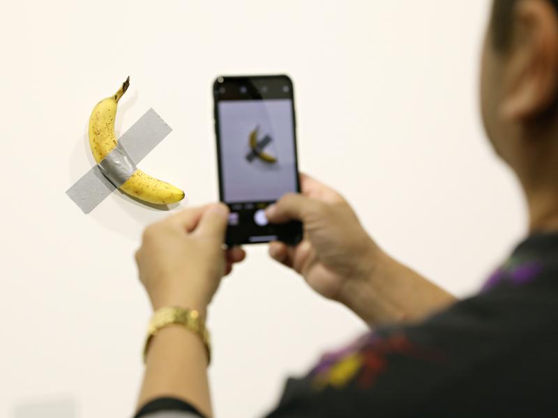Two editions of Maurizio Cattelan's Comedian, a banana duct-taped to a wall, have reportedly sold for more than $100,000. Two editions of Maurizio Cattelan's Comedian, a banana duct-taped to a wall, have reportedly sold for more than $100,000.