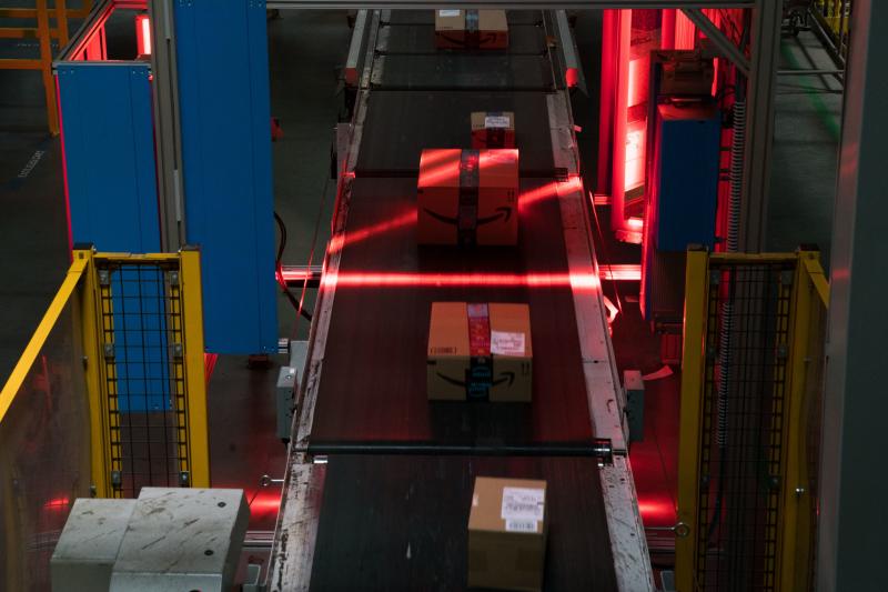 Amazon boxes are scanned on conveyor belts. AI systems keep track of all items in the warehouses, which can be as vast as 1 million square feet. Amazon boxes are scanned on conveyor belts. AI systems keep track of all items in the warehouses, which can be as vast as 1 million square feet.
