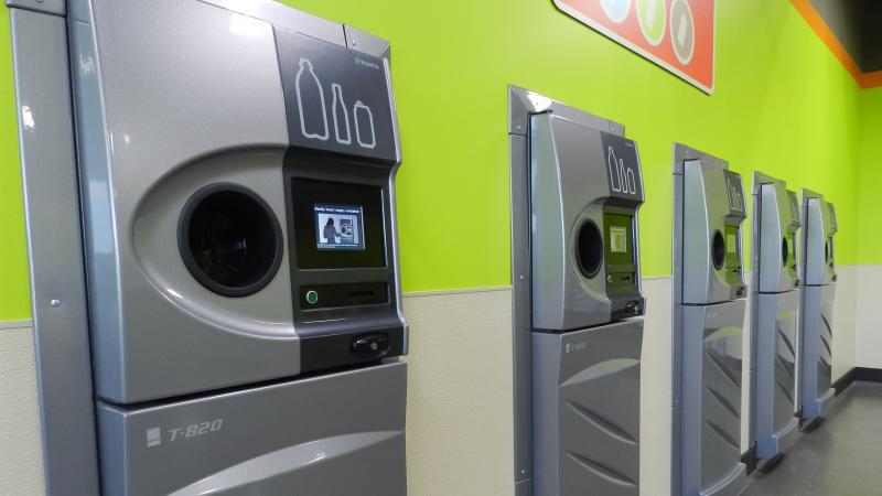 A row of new reverse vending machines, which collect drink containers for recycling, greets customers at the grand opening of the BottleDrop Redemption Center in Medford, Ore. A row of new reverse vending machines, which collect drink containers for recycling, greets customers at the grand opening of the BottleDrop Redemption Center in Medford, Ore.