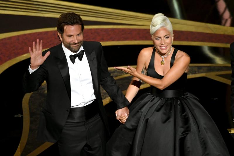 Bradley Cooper and Lady Gaga address the crowd after performing onstage at the Academy Awards. Their song "Shallow" later won the Oscar for original song. Bradley Cooper and Lady Gaga address the crowd after performing onstage at the Academy Awards. Their song "Shallow" later won the Oscar for original song.