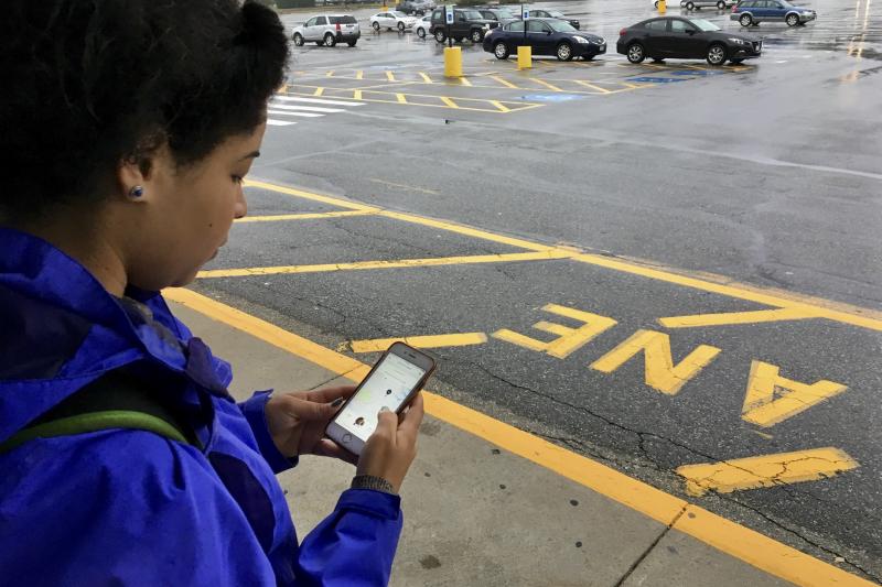 Dania Matos, 22, a student at North Short Community College in Danvers, Mass., waits for an Uber car to take her to school. Dania Matos, 22, a student at North Short Community College in Danvers, Mass., waits for an Uber car to take her to school.