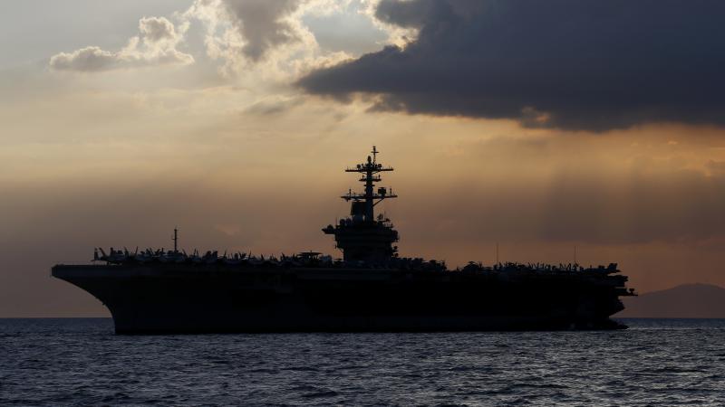 The aircraft carrier USS Theodore Roosevelt aircraft carrier anchored off Manila Bay west of Manila, Philippines, in a photo from 2018. The aircraft carrier USS Theodore Roosevelt aircraft carrier anchored off Manila Bay west of Manila, Philippines, in a photo from 2018.