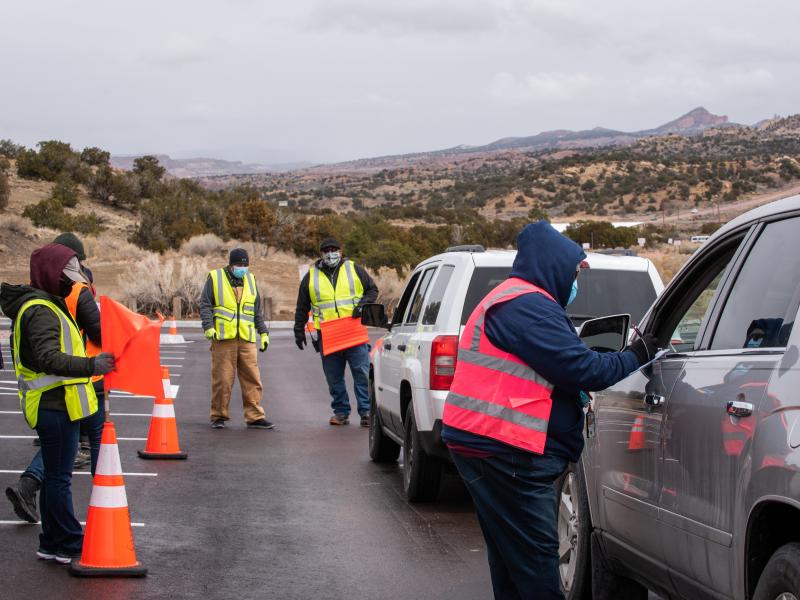 Workers greet arrivals at a drive-in vaccination site at University of New Mexico's Gallup campus in Gallup, N.M., on March 23. The Navajo Nation has vaccinated more than half of its adult population, outpacing the U.S. national rate. Workers greet arrivals at a drive-in vaccination site at University of New Mexico's Gallup campus in Gallup, N.M., on March 23. The Navajo Nation has vaccinated more than half of its adult population, outpacing the U.S. national rate.