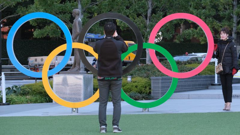 A couple takes pictures with the Olympic rings monument near the National Stadium for the Tokyo 2020 Olympic Games on Feb. 4. Organizers have decided that overseas spectators won't be allowed to attend the Games this summer. A couple takes pictures with the Olympic rings monument near the National Stadium for the Tokyo 2020 Olympic Games on Feb. 4. Organizers have decided that overseas spectators won't be allowed to attend the Games this summer.