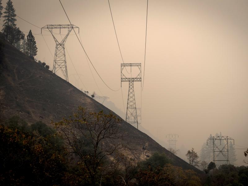 California utility PG&E Corp. said Monday that it plans to file for bankruptcy over what it estimates could be $30 billion in potential liability costs from recent wildfires. Here, transmission towers in a valley near Paradise, Calif., as the Camp Fire bu California utility PG&E Corp. said Monday that it plans to file for bankruptcy over what it estimates could be $30 billion in potential liability costs from recent wildfires. Here, transmission towers in a valley near Paradise, Calif., as the Camp Fire bu