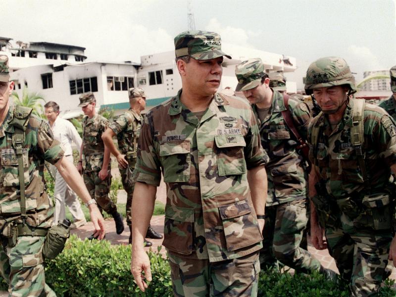 Gen. Colin Powell, head of the Joint Chiefs of Staff, tours the bombed courtyard of the Panamanian Defense Force Comandancia in Panama City during the U.S. invasion of Panama on Jan. 5, 1990. Gen. Colin Powell, head of the Joint Chiefs of Staff, tours the bombed courtyard of the Panamanian Defense Force Comandancia in Panama City during the U.S. invasion of Panama on Jan. 5, 1990.