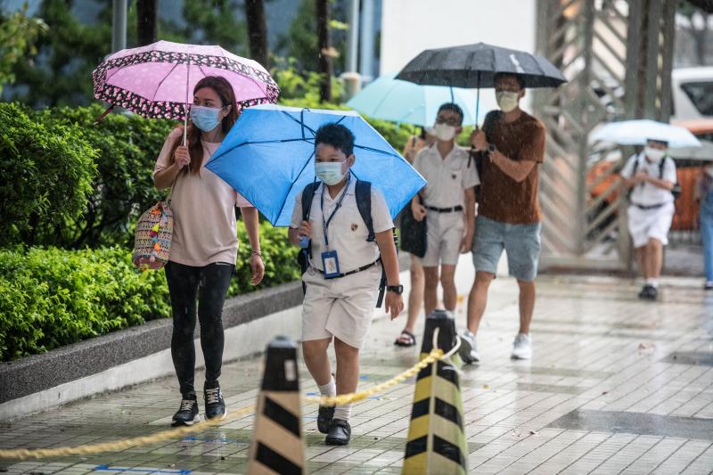 Children arrive at Hong Kong's Maryknoll Fathers' Primary School on June 8, the first day of classes since the COVID-19 outbreak. Children arrive at Hong Kong's Maryknoll Fathers' Primary School on June 8, the first day of classes since the COVID-19 outbreak.